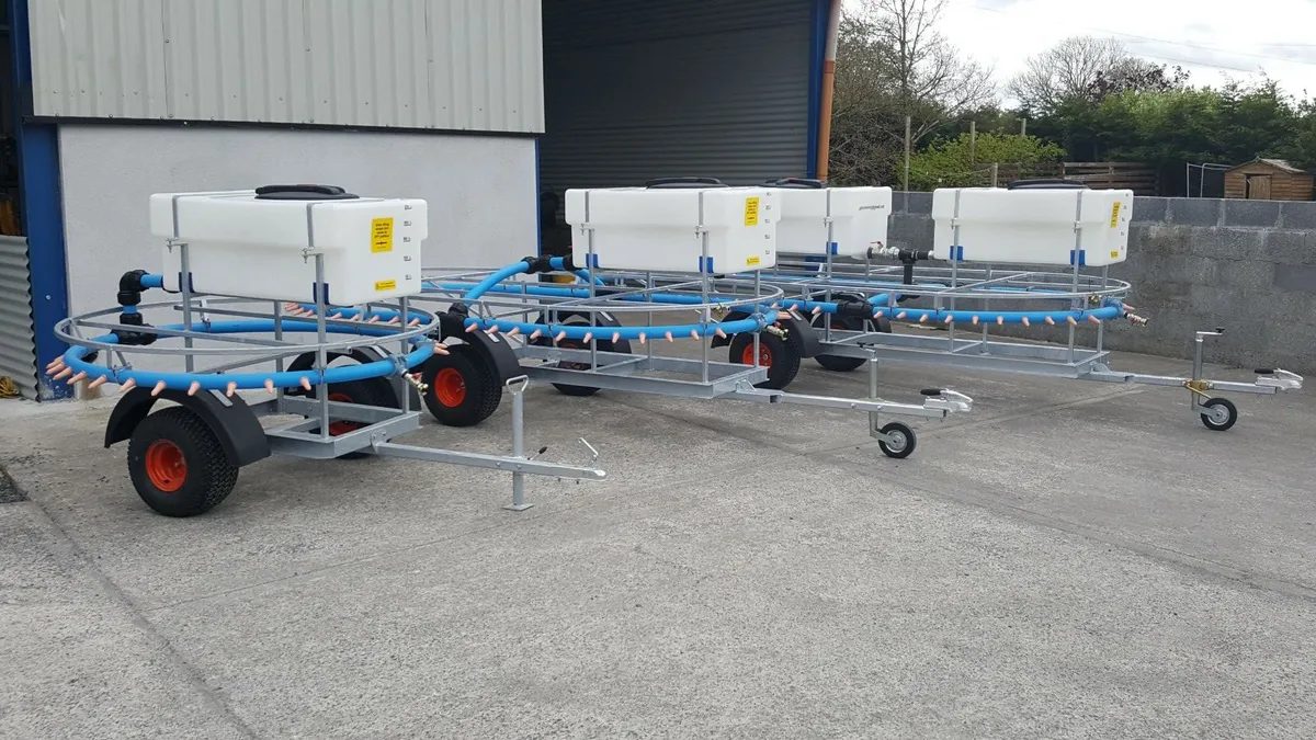 Three Gateswide mobile calf feeders lined up ready for delivery